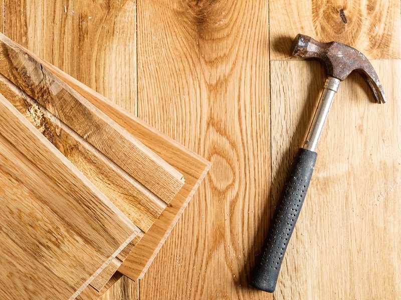 Hammer on hardwood planks - Hardwood flooring installation services from The Carpet Shoppe Inc in Tulare, CA